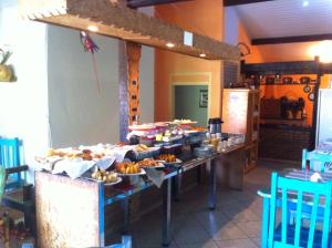 Pousada Requinte da Mantiqueira tesisinde bir restoran veya yemek mekanı