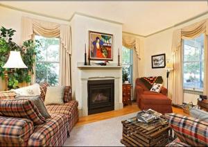 a living room with two couches and a fireplace at Black Lantern B&B in Topsham