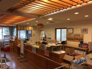a restaurant with a counter with boxes on it at Auto Resort Takino in Sapporo