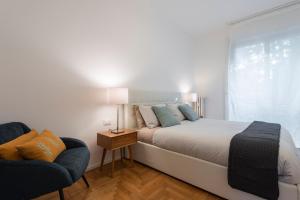 Un pat sau paturi într-o cameră la Mila Apartments Via Savona