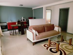 a living room with a couch and a table at Residence Maeva in Mamoudzou