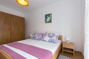 Posteľ alebo postele v izbe v ubytovaní Holiday House Natasa