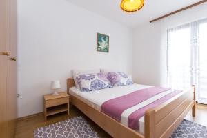 Posteľ alebo postele v izbe v ubytovaní Holiday House Natasa