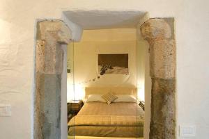 A bed or beds in a room at Maison Bondaz & SPA privé