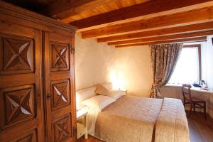 A bed or beds in a room at Maison Bondaz & SPA privé