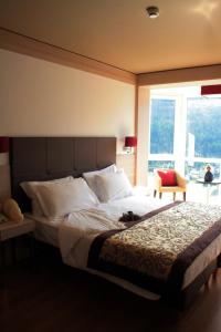 เตียงในห้องที่ Antelao Dolomiti Mountain Resort