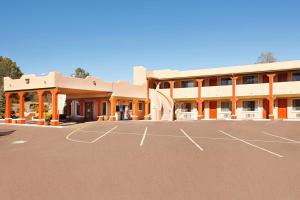 an empty parking lot in front of a building at Super 8 by Wyndham Payson in Payson