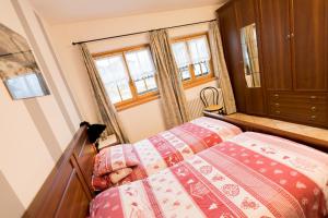 Posteľ alebo postele v izbe v ubytovaní Chalet Aurora