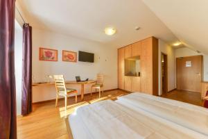 Postel nebo postele na pokoji v ubytování Landgasthof - Hotel Reindlschmiede