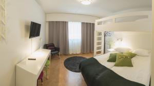 Postel nebo postele na pokoji v ubytování Hotel Kittilä + 16 fotografií