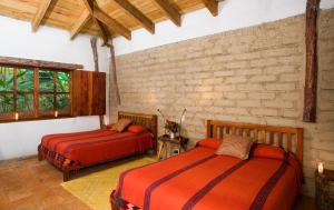 Postel nebo postele na pokoji v ubytování Hotel Hacienda San Lucas