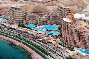 an overhead view of a large resort building with pools at Apartment in Porto Sokhna Pyramids for Families in Ain Sokhna