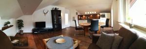 a living room with a couch and a table at Ferienwohnung Traudl in Inzell