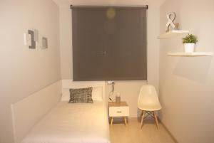 Posteľ alebo postele v izbe v ubytovaní Apartamentos Real Lleida