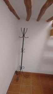 a metal object in a corner of a room at Casa Andaluza in La Zubia