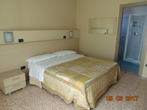 Postel nebo postele na pokoji v ubytování Hotel Mazzocchetti
