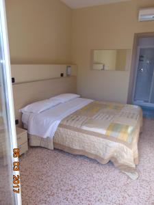 Voodi või voodid majutusasutuse Hotel Mazzocchetti toas