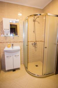 a bathroom with a shower and a sink at SimplyComfy in Plovdiv