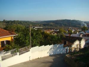 a view of a city from above a wall at Vivenda tilia in Pernes +13 photos