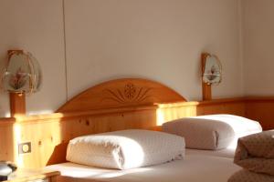 Tempat tidur dalam kamar di Hotel Soliva