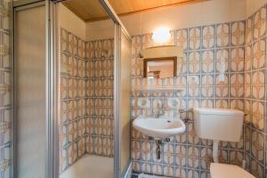 a bathroom with a sink and a shower at Residence Trametsch in Bressanone