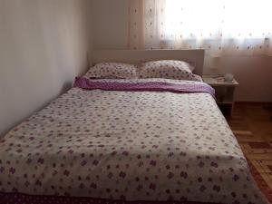 Postel nebo postele na pokoji v ubytování Apartman Ana