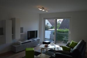 TV a/nebo společenská místnost v ubytování Boardinghouse-Niedernberg