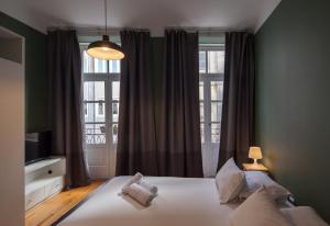 Krevet ili kreveti u jedinici u objektu Aparthotel Oporto Entreparedes