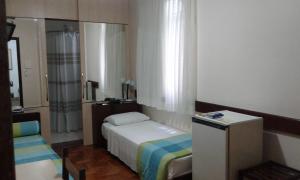 Cama ou camas em um quarto em Hotel São Bento