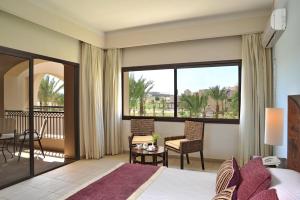 A bed or beds in a room at JAZ Neo Saraya Palms