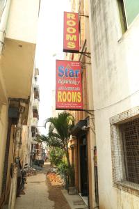 a sign for a restaurant on a building at Star Residency in Chennai