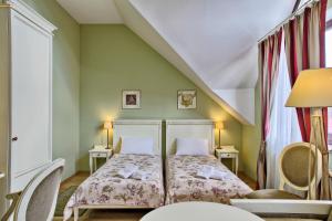 Кровать или кровати в номере Villa Estera - Hotel & Restauracja