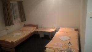 Postel nebo postele na pokoji v ubytování Penzion Tágo Bohumín