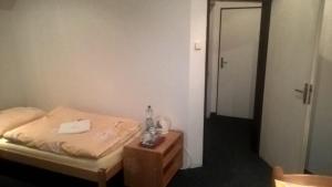 Postel nebo postele na pokoji v ubytování Penzion Tágo Bohumín