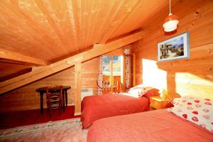 En eller flere senge i et værelse på L'ARBA-CLAR