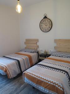 Ліжко або ліжка в номері Apartamento VI-VI (Vida en Vitoria)