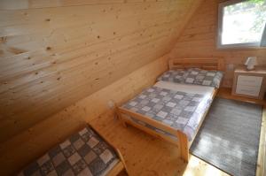 Łóżko lub łóżka w pokoju w obiekcie Ośrodek 9Amber