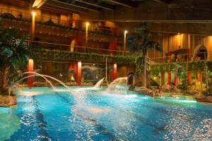 a pool in a hotel with a water park at Haus Schweitzer - Naturns in Naturno