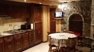 Kuchyň nebo kuchyňský kout v ubytování Taverna Semon
