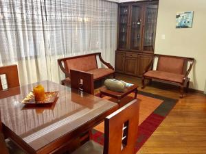 Кът за сядане в Altura Rooms & Suites