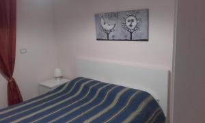 A bed or beds in a room at B&B la Palma