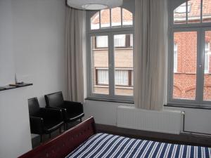 TV a/nebo společenská místnost v ubytování Guesthouse Oude Houtmarkt