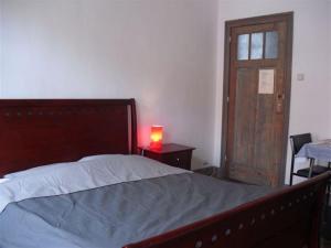 Postel nebo postele na pokoji v ubytování Guesthouse Oude Houtmarkt