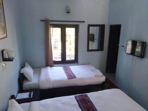 Postelja oz. postelje v sobi nastanitve Yeti Guest House