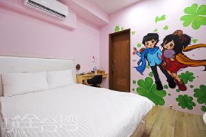 Postel nebo postele na pokoji v ubytování Ark stay方舟文旅山嵐新館溜滑梯商務民宿
