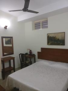 Postel nebo postele na pokoji v ubytování Safire Residency