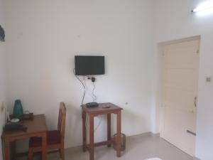 TV a/nebo společenská místnost v ubytování Safire Residency