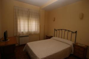 Posteľ alebo postele v izbe v ubytovaní Hostal Sunami + 10 fotografií