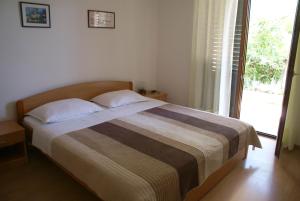 Postel nebo postele na pokoji v ubytování Apartment Ana M