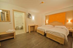 Voodi või voodid majutusasutuse Hotel Niagara toas